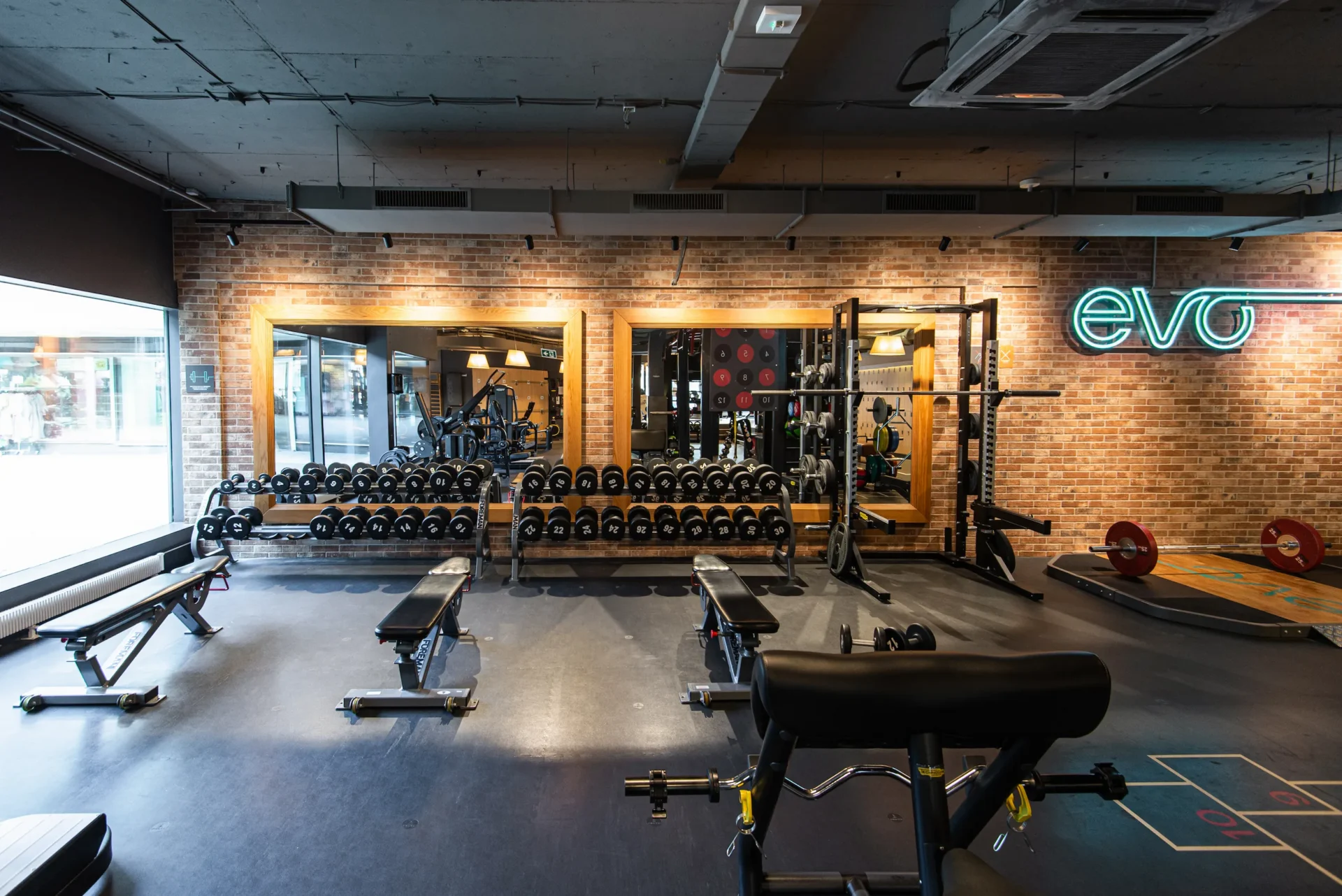 evo fitness bern free weight area dumbbells rack mirror window