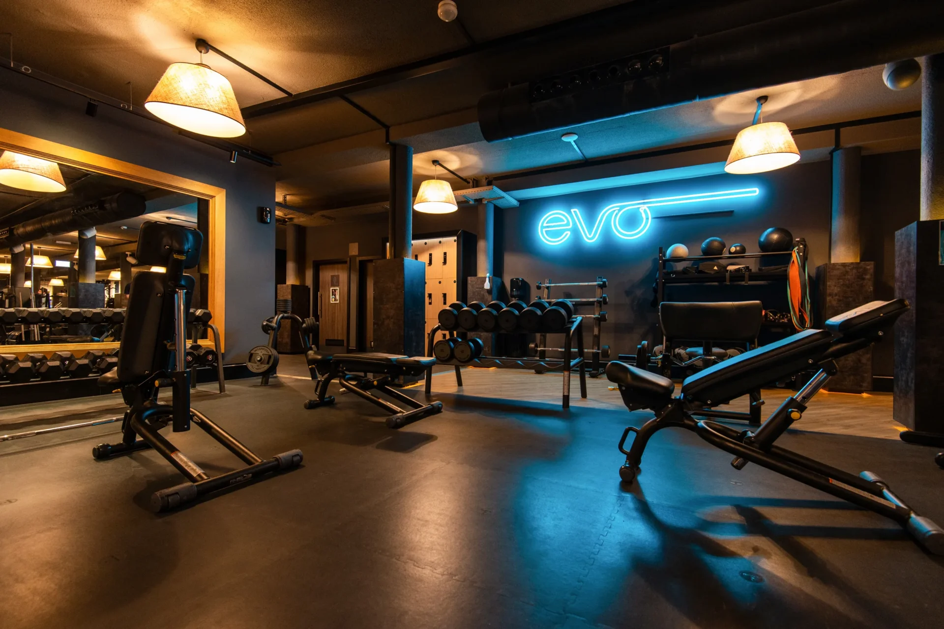 evo fitness geneva acacias strength area with neon sign