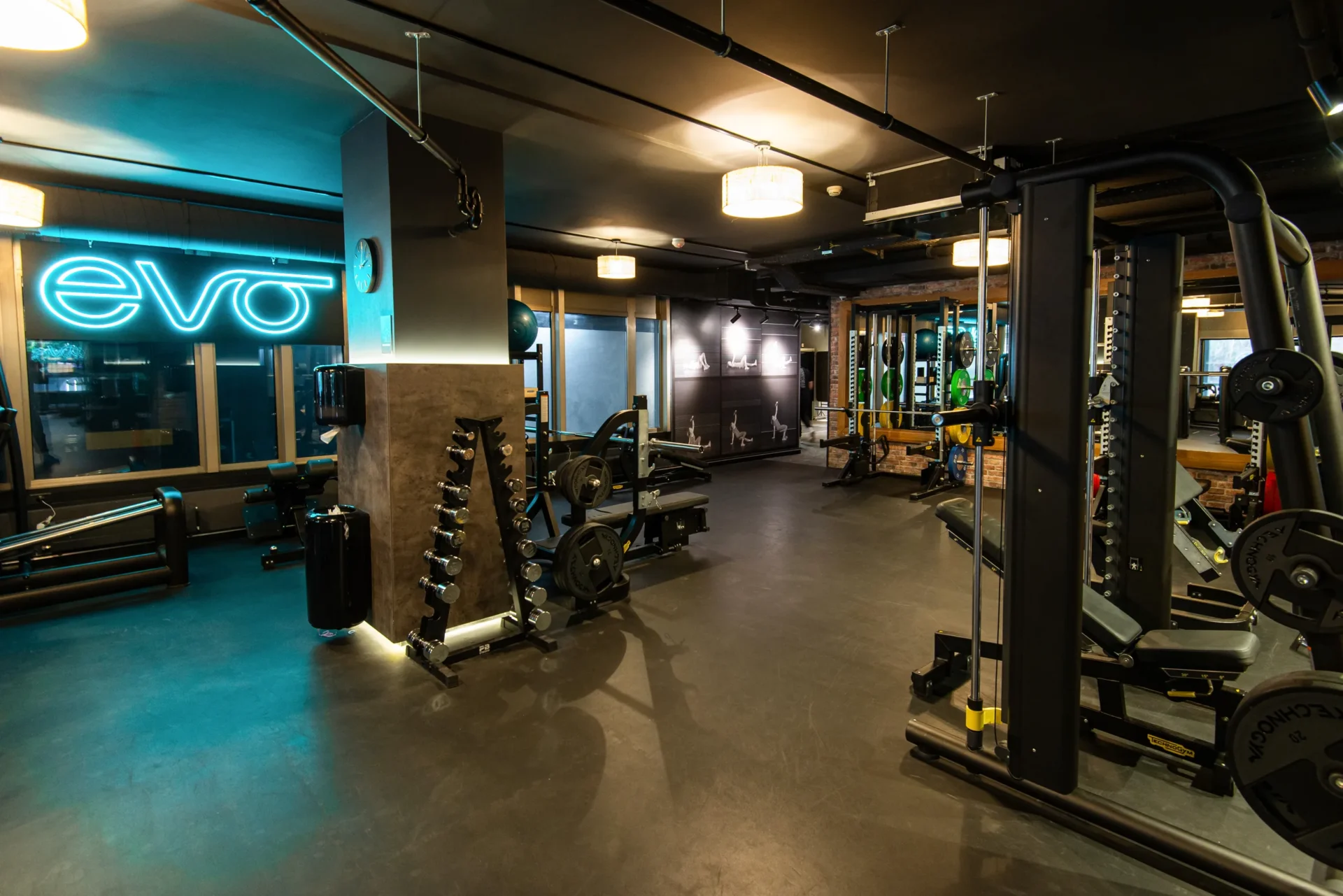 evo fitness geneva champel strength training area neon logo