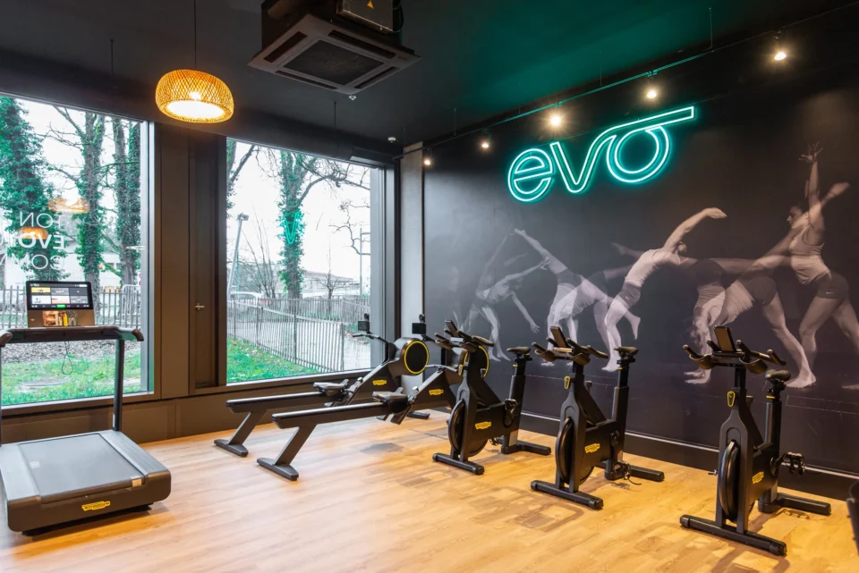 evo fitness geneva green village cardio area neon logo wall graphic