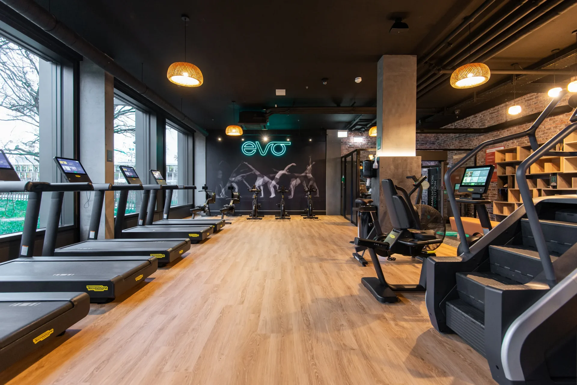 evo fitness geneva green village cardio area neon logo window