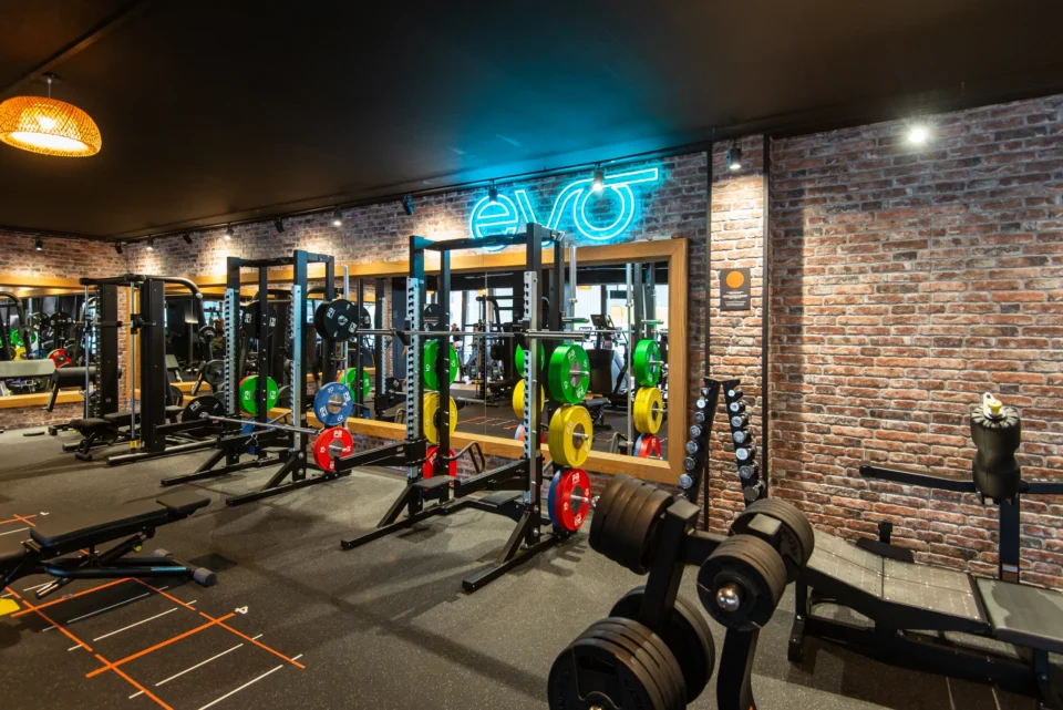 evo fitness geneva jonction strength area squat racks neon logo